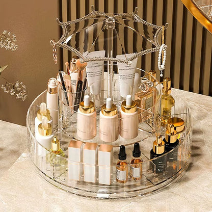 Multi-tier rotating makeup organizer with clear acrylic walls, gold accents, and umbrella top