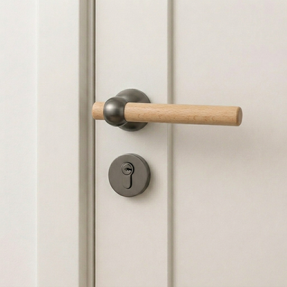 Light wood door lever handle with brushed silver round silent lock trim and key cylinder