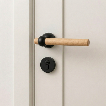 Walnut-finish door lever handle with matte black round silent lock trim and key cylinder