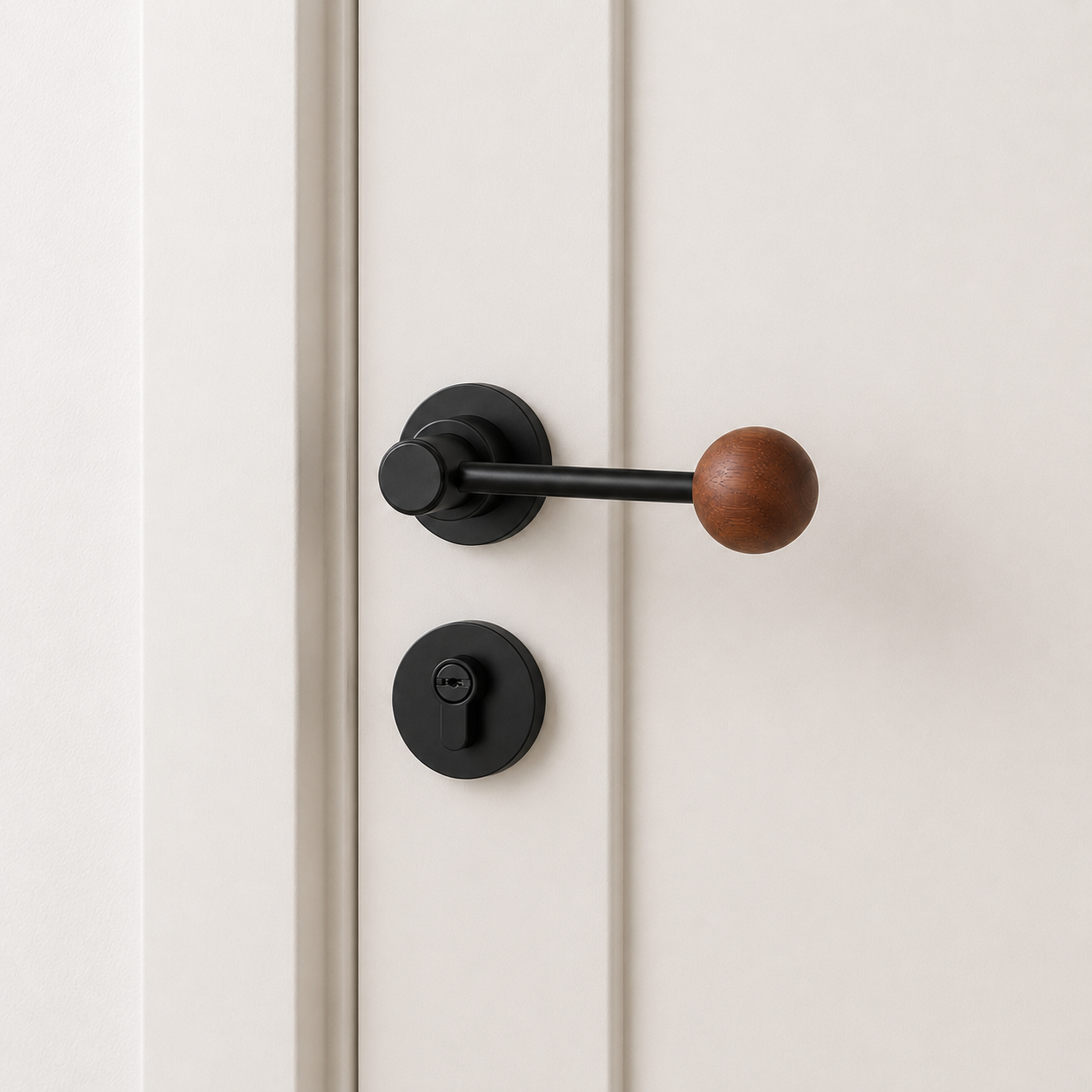 Split door lock handle with walnut ball lever and black round backplate