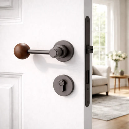 Split door lock handle with walnut ball lever and dark round backplates