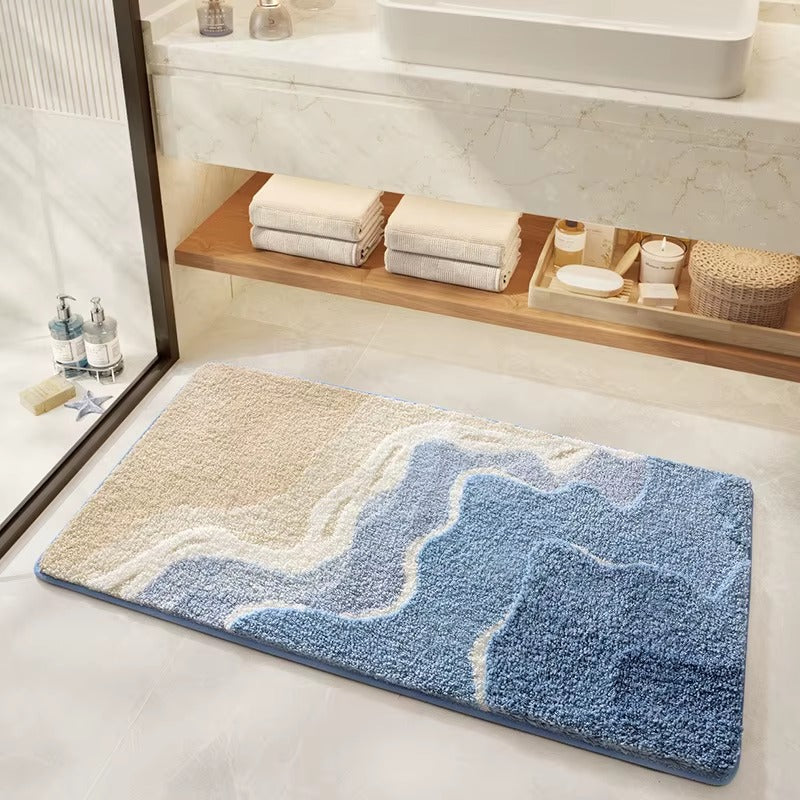 Fowey beach wave microfibre non-slip bath mat with blue wave design on beige base
