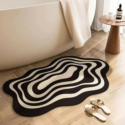Black and beige wavy ripple non-slip bath mat in front of bathtub and shoes