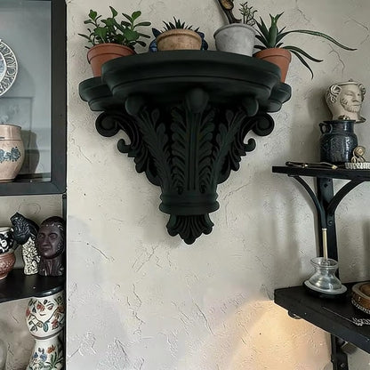 Black decorative corbel floating shelf with carved column and curled side scrolls