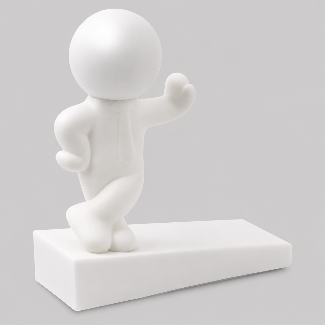 White playful character door stop in leaning pose, one arm out, on a rectangular base