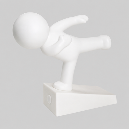 White playful character door stop in balancing pose, arms outstretched on a rectangular base