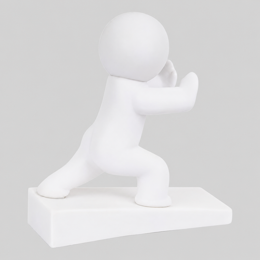 White playful character door stop in pushing pose, raised on a rectangular base