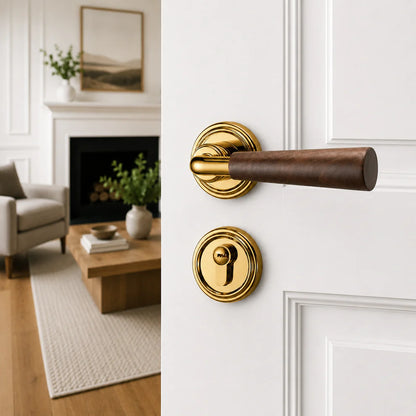 Interior door lock handle with dark wood lever and polished gold round rosettes