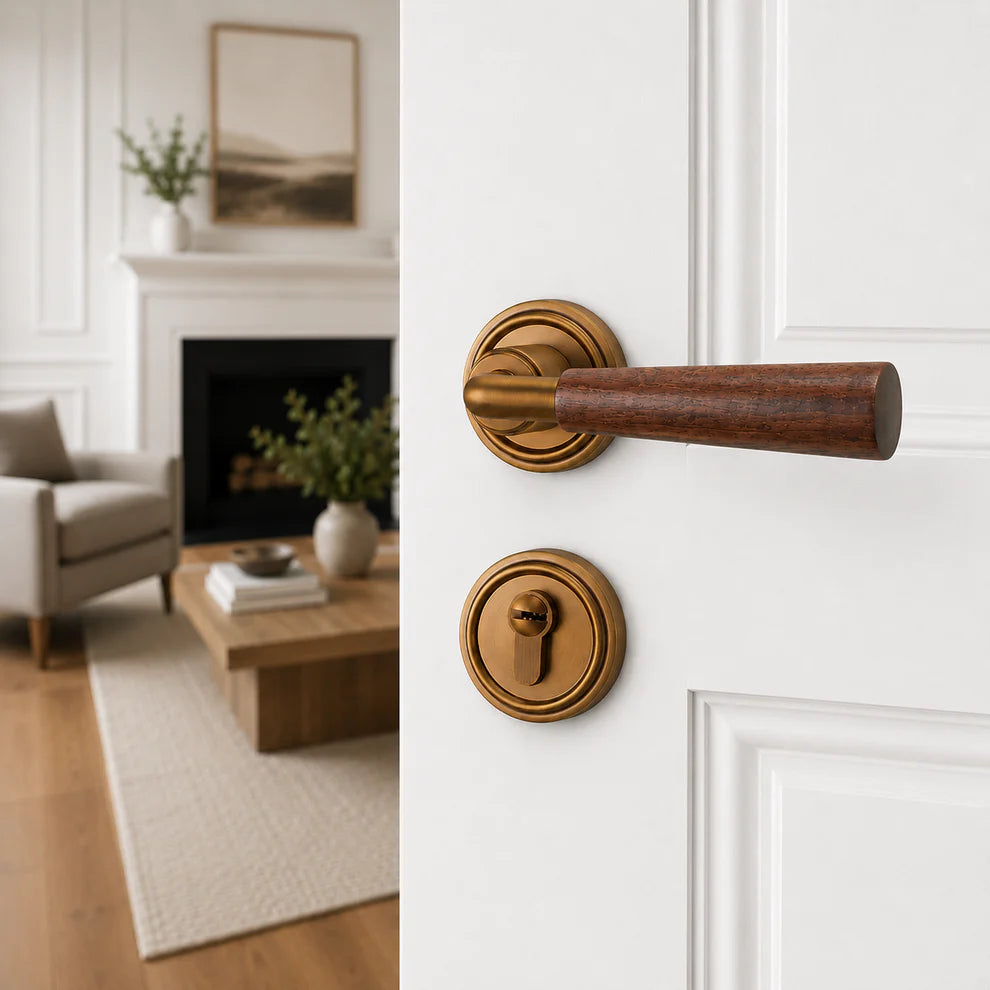 Interior door lock handle with brown wood lever and gold round rosettes