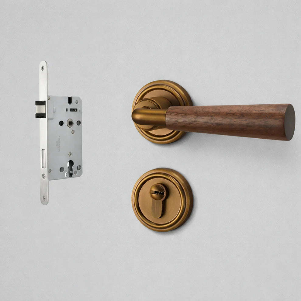 Interior door lock handle set with brown wood lever and gold round rosettes