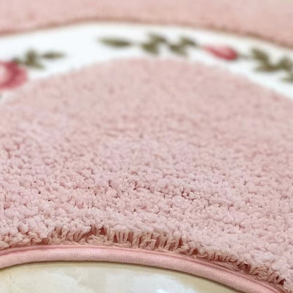 Close-up of pink textured bath mat pile with pink edge trim