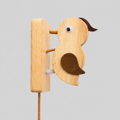 Wooden woodpecker door knocker with round metal eye and attached mounting board