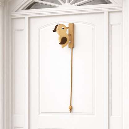 Wooden woodpecker door knocker mounted on a door with braided cord pull