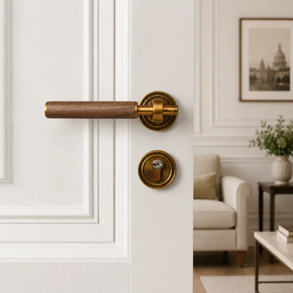 Walnut door lever lock with antique brass round backplate and key cylinder